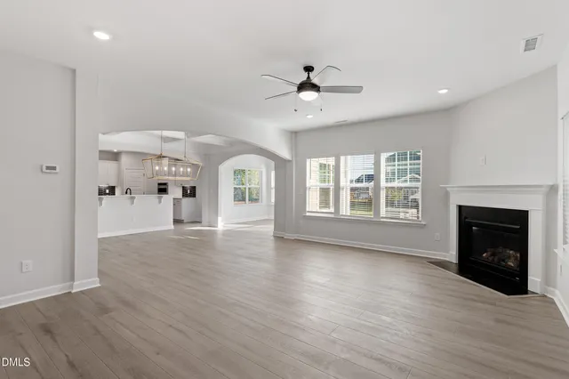 a kitchen with stainless steel appliances kitchen island a sink a stove and cabinets