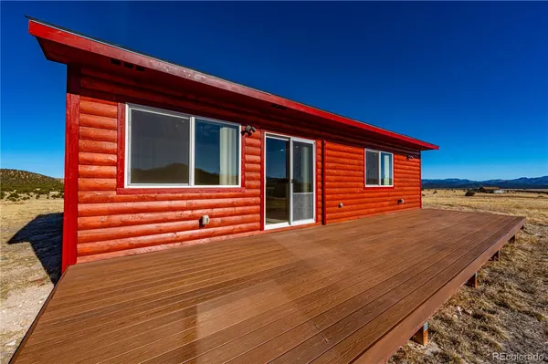 a backyard of a house with wooden fence