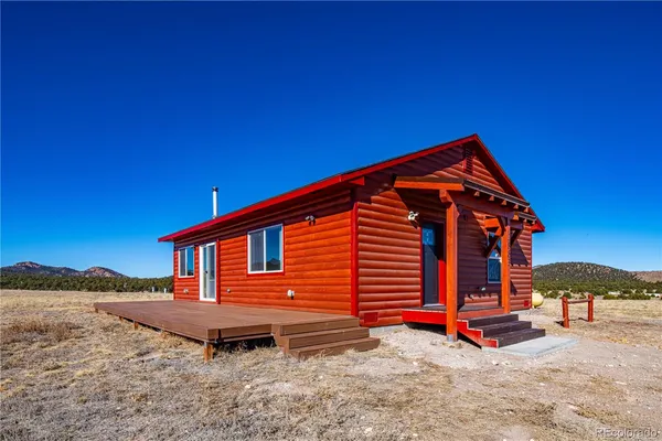 a backyard of a house with a yard and garage