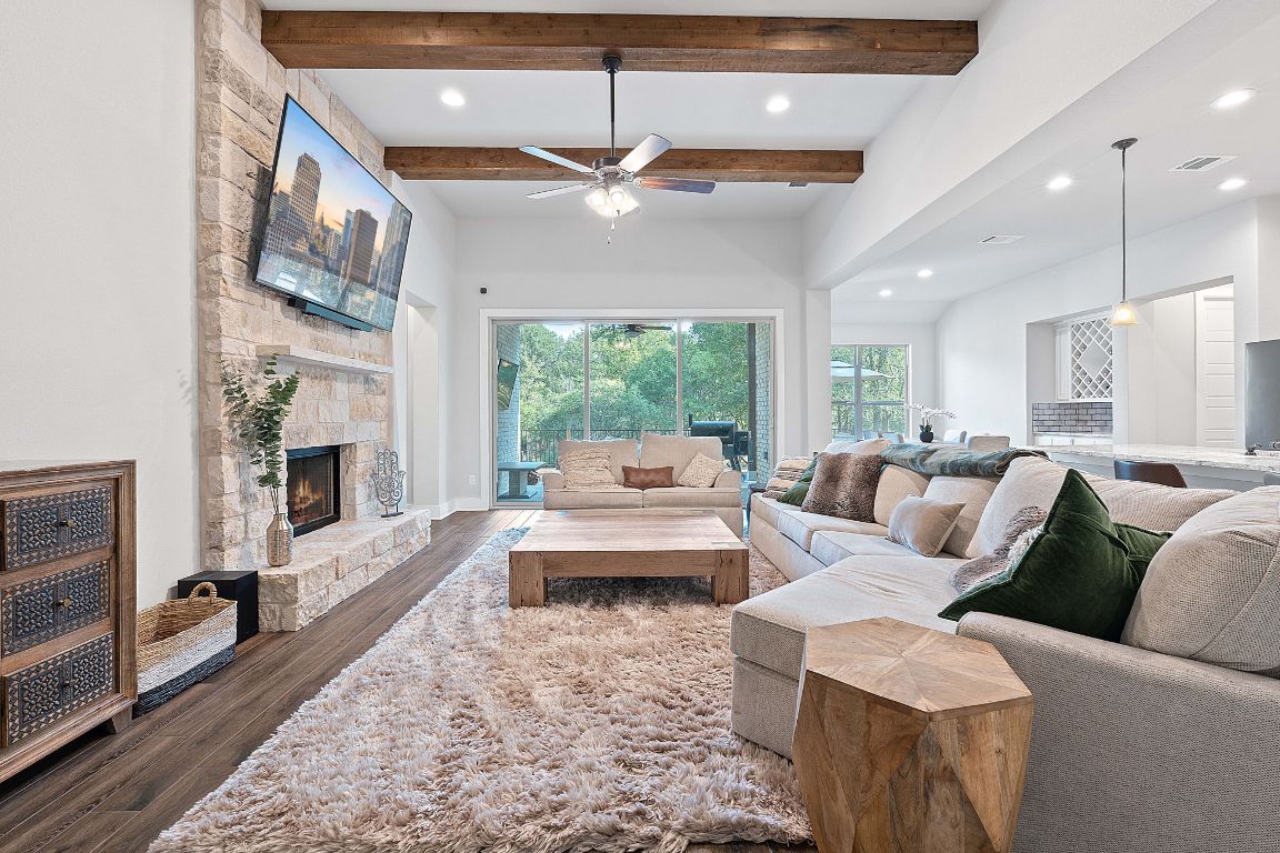 159 Raptor Beak Way Cedar Creek, TX 78612 - Photo 2 of 31 a living room with furniture fireplace and a large window