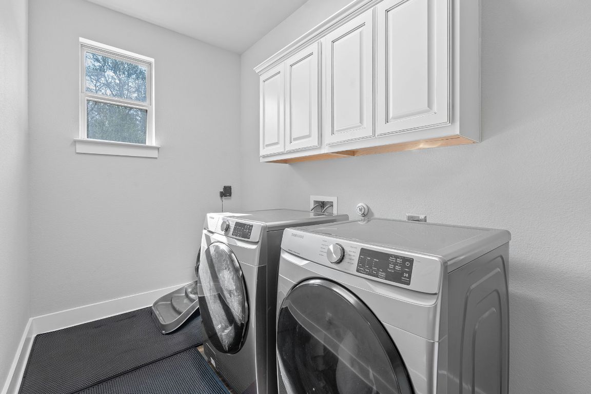 159 Raptor Beak Way Cedar Creek, TX 78612 - Photo 25 of 31 a utility room with dryer and washer