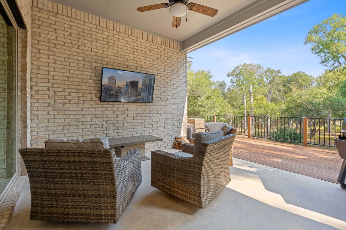 159 Raptor Beak Way Cedar Creek, TX 78612 - Photo 26 of 31 a balcony with furniture and a potted plant