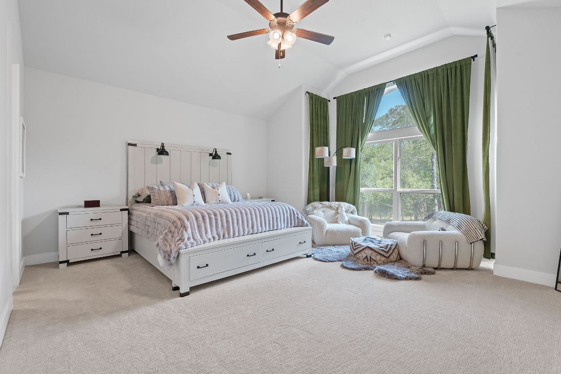 159 Raptor Beak Way Cedar Creek, TX 78612 - Photo 6 of 31 a bedroom with bed and large window