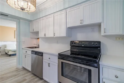 a kitchen with cabinets and appliances