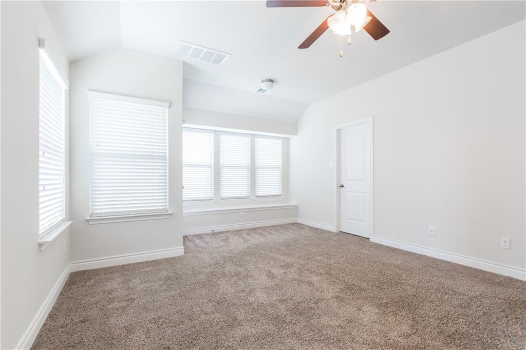 2104 Pindos Pony Way Georgetown, TX 78626 - Photo 14 of 30 A quiet retreat with a soaring vaulted ceiling and sun-filled windows offers comfortable living.