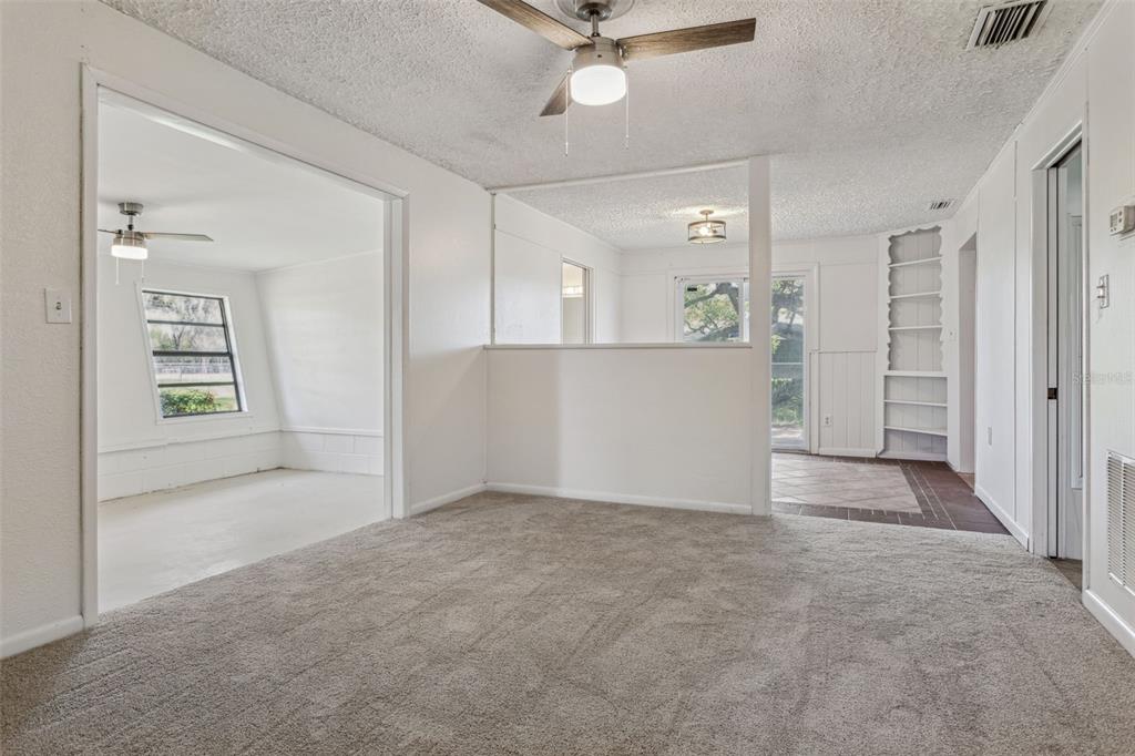 33546 Chancey Road Wesley Chapel, FL 33543 - Photo 14 of 25 an empty room with windows and cabinet