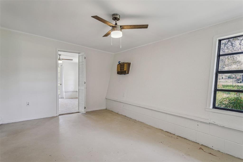 33546 Chancey Road Wesley Chapel, FL 33543 - Photo 15 of 25 an empty room with a ceiling fan and window