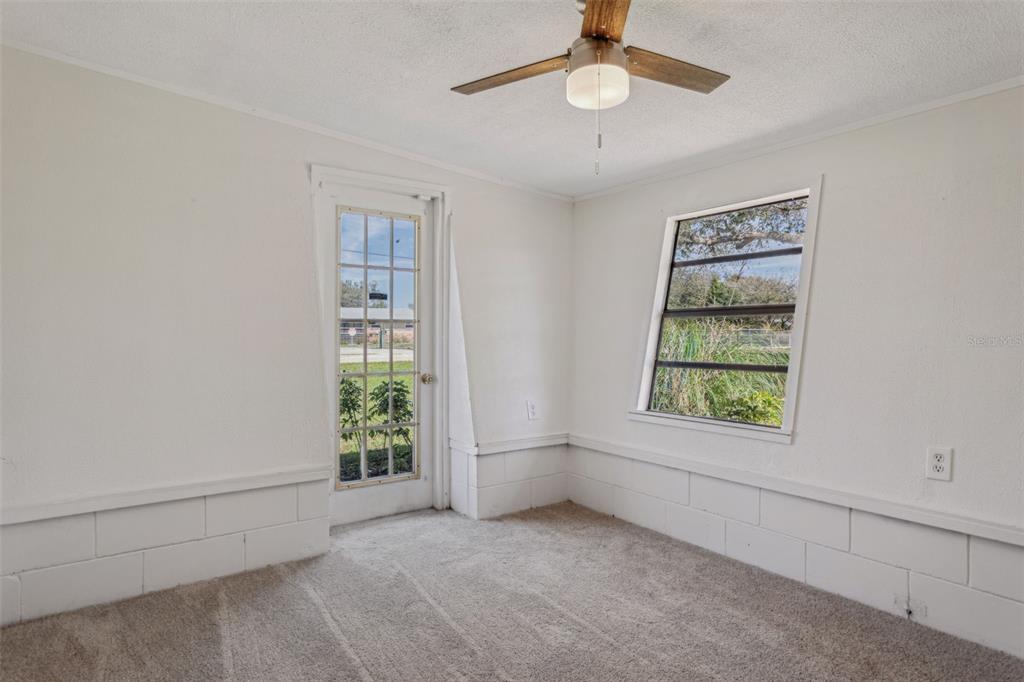 33546 Chancey Road Wesley Chapel, FL 33543 - Photo 16 of 25 an empty room with windows and closet