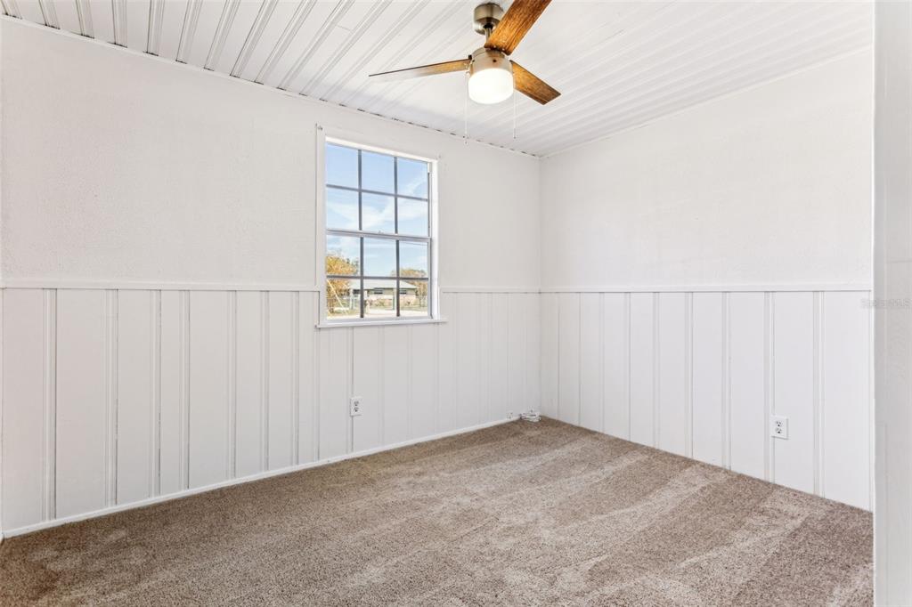 33546 Chancey Road Wesley Chapel, FL 33543 - Photo 19 of 25 an empty room with windows and fan view