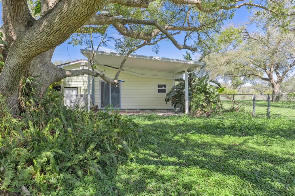 33546 Chancey Road Wesley Chapel, FL 33543 - Photo 21 of 25 a view of a house with a yard