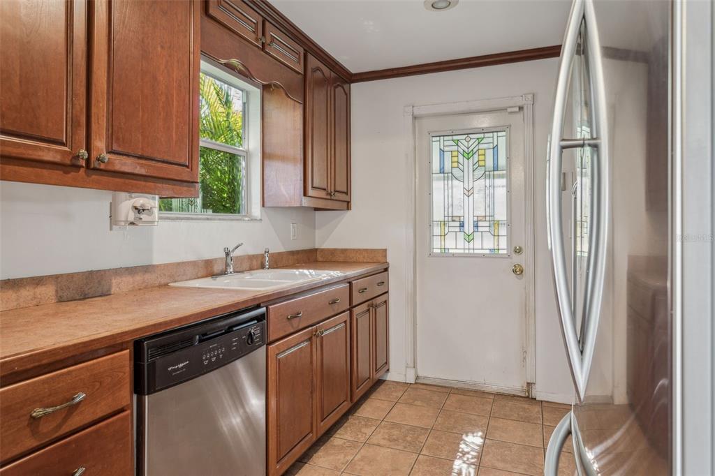 33546 Chancey Road Wesley Chapel, FL 33543 - Photo 6 of 25 a kitchen with a sink cabinets and window