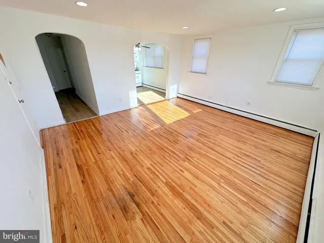 a bedroom with a bed and a chair