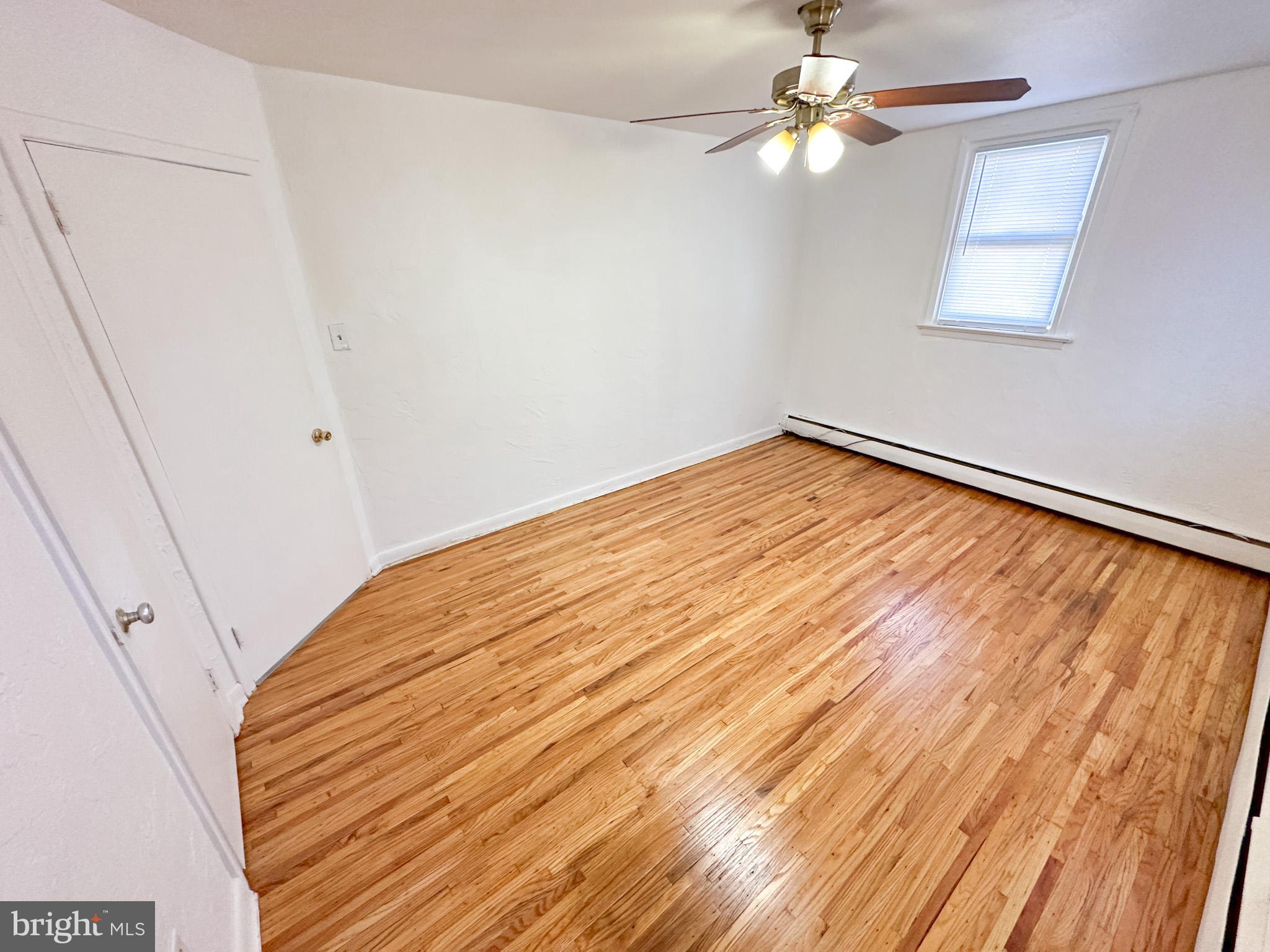 1205-7 Princeton Avenue, Unit C Philadelphia, PA 19111 - Photo 5 of 15 a view of empty room with wooden floor