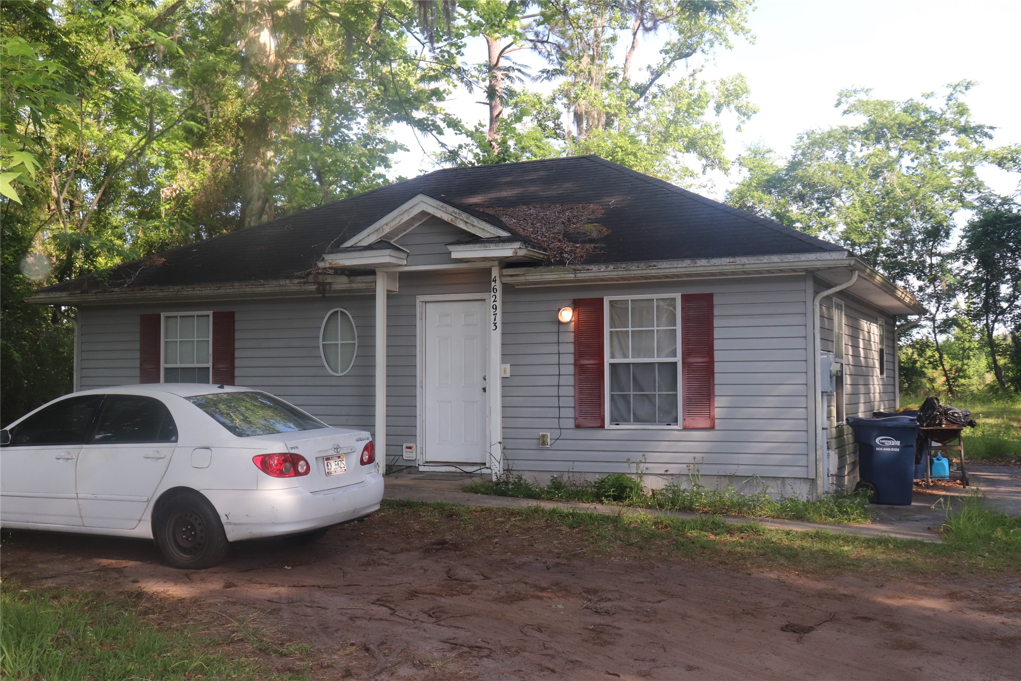 462973 State Road 200 Yulee, FL 32097 - Photo 16 of 18 a front view of a house with a yard