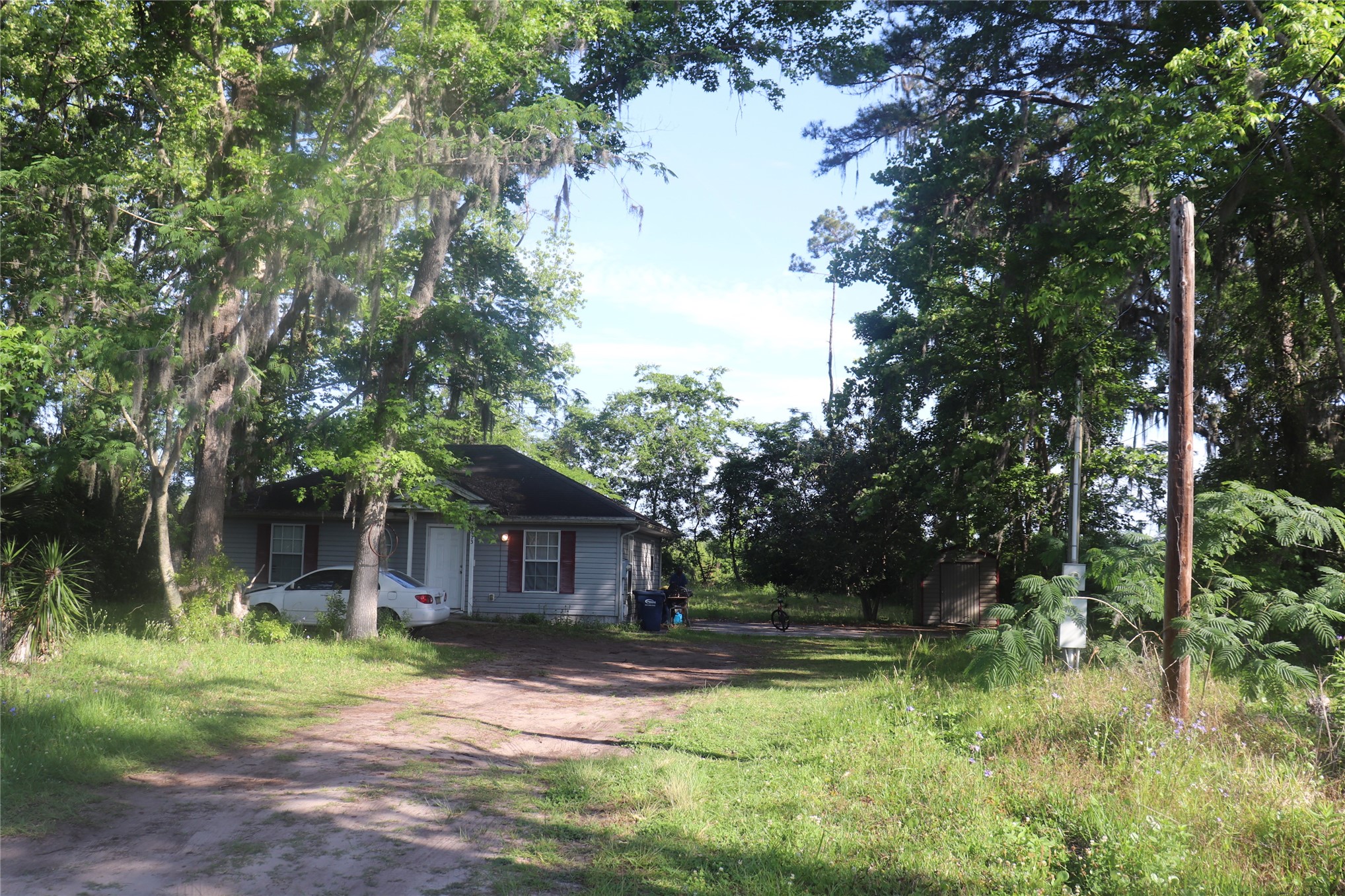 462973 State Road 200 Yulee, FL 32097 - Photo 18 of 18 a front view of a house with yard and green space