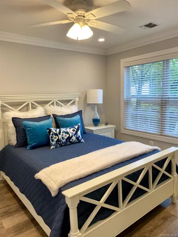 a view of a dining room with furniture and a window