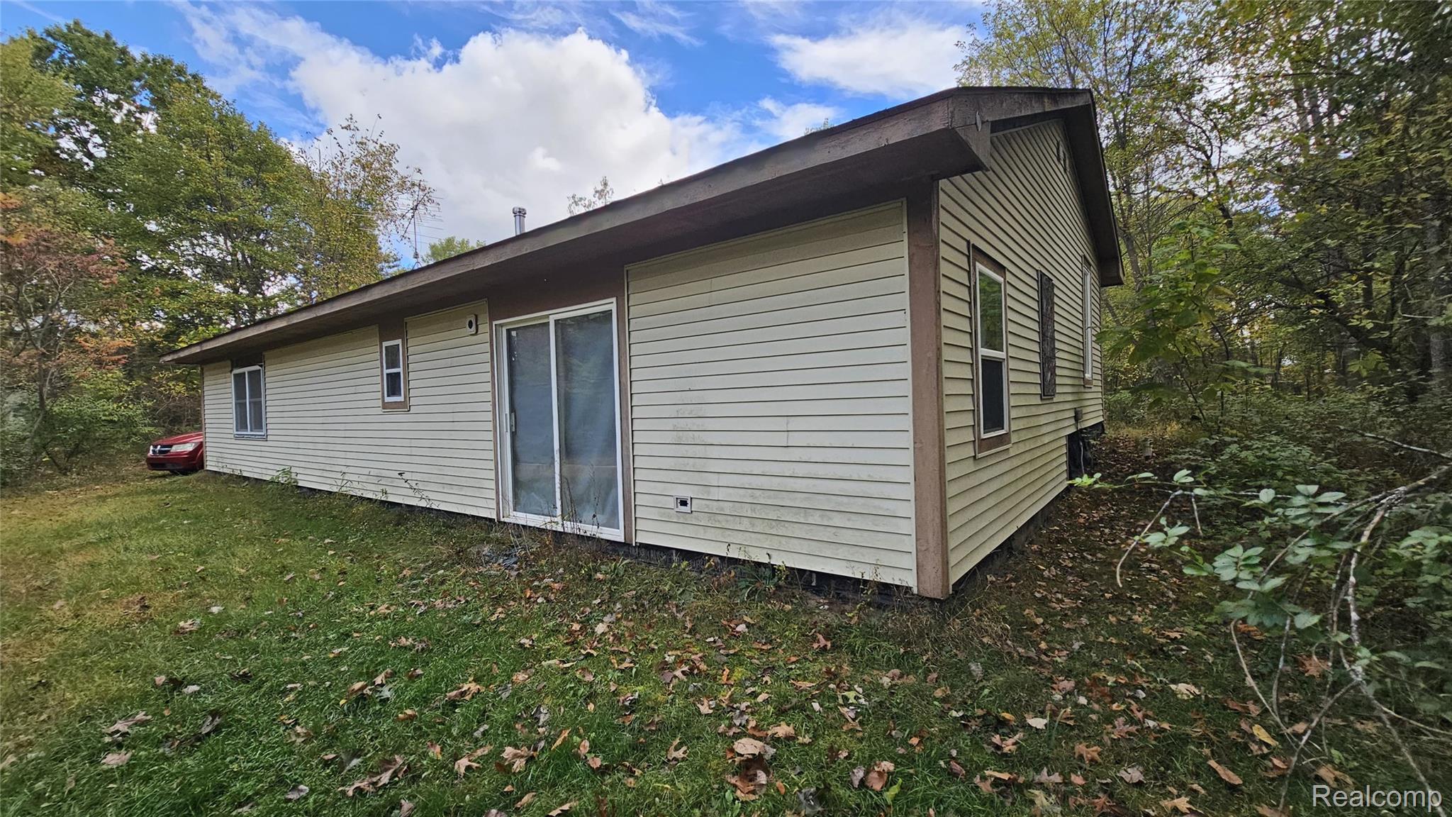 37 Risch Road North Webberville, MI 48892 - Photo 18 of 20 View of home's exterior featuring a yard
