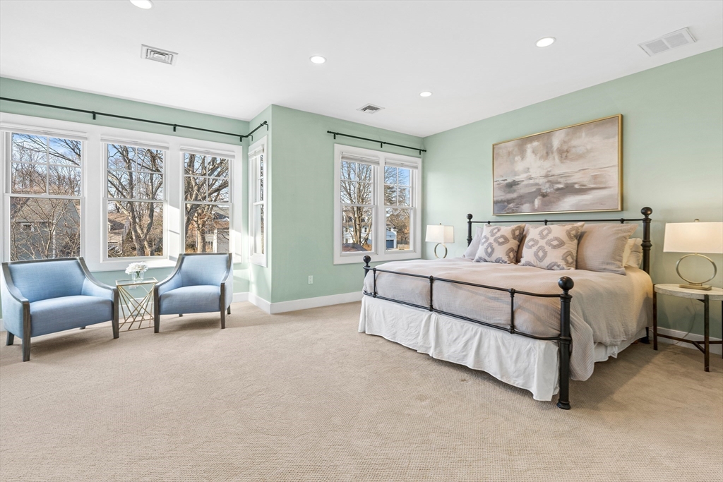 9 Patton Road Wellesley, MA 02482 - Photo 17 of 34 a spacious bedroom with a bed a couch and a large window