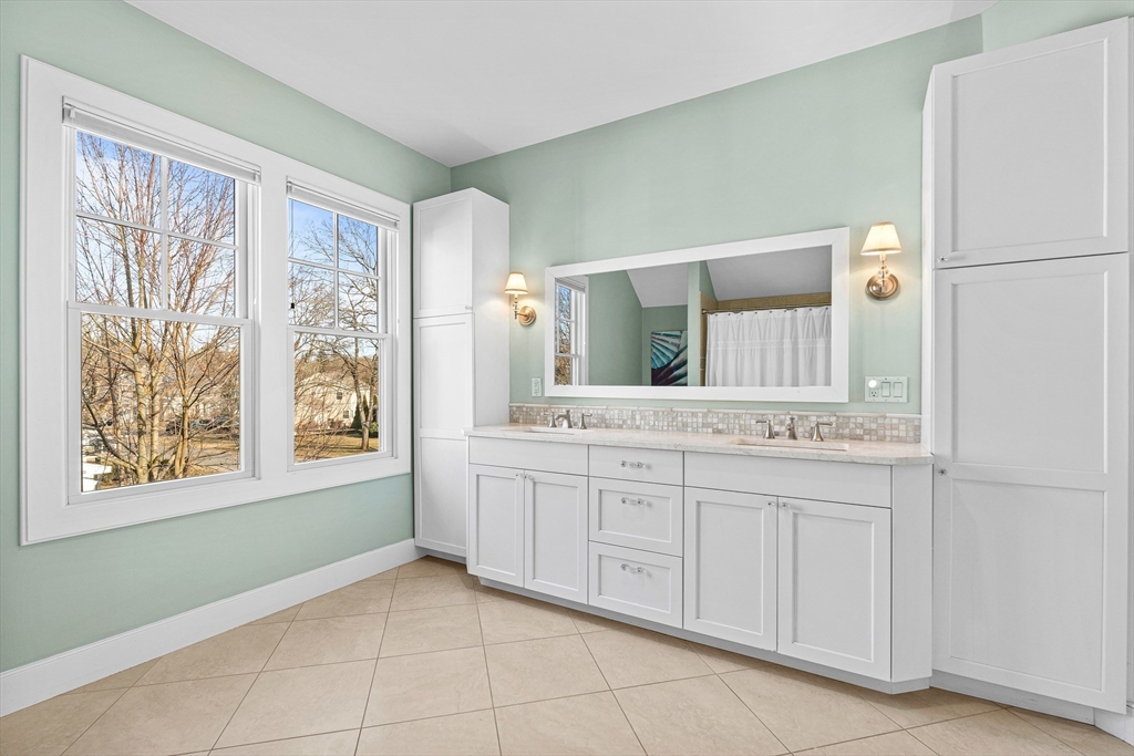 9 Patton Road Wellesley, MA 02482 - Photo 24 of 34 a bathroom with a granite countertop sink and a mirror