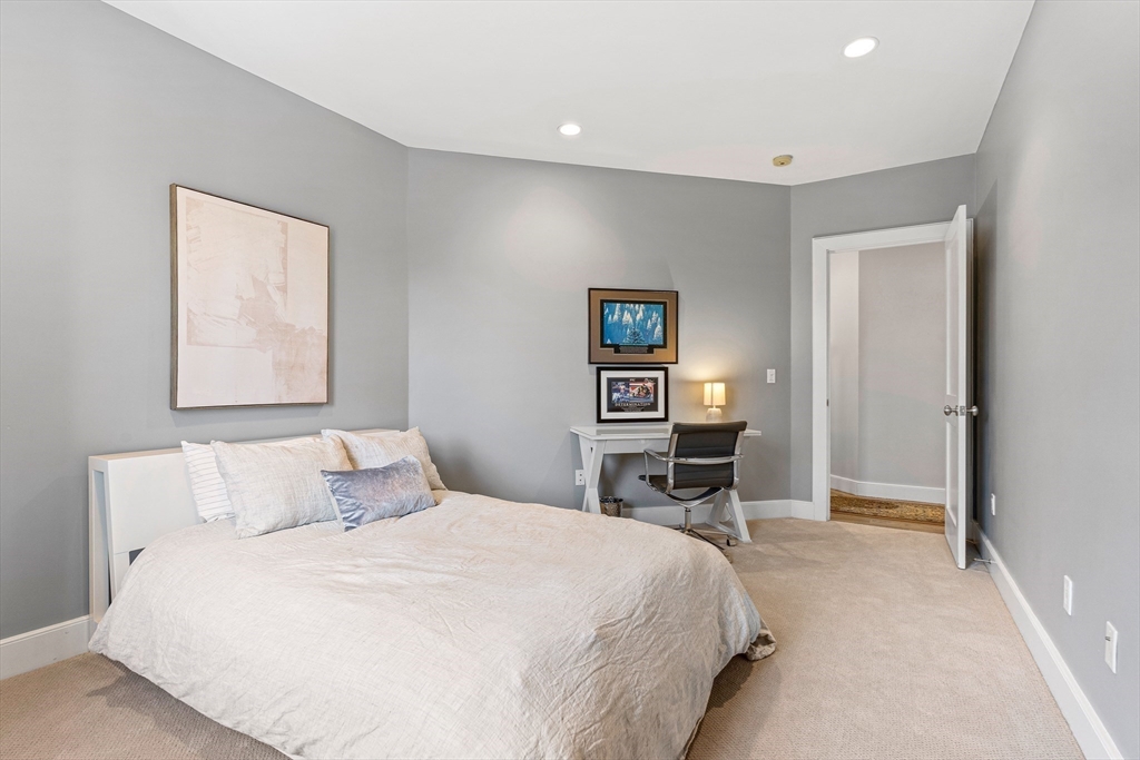 9 Patton Road Wellesley, MA 02482 - Photo 25 of 34 a bedroom with a bed and a lamp on table