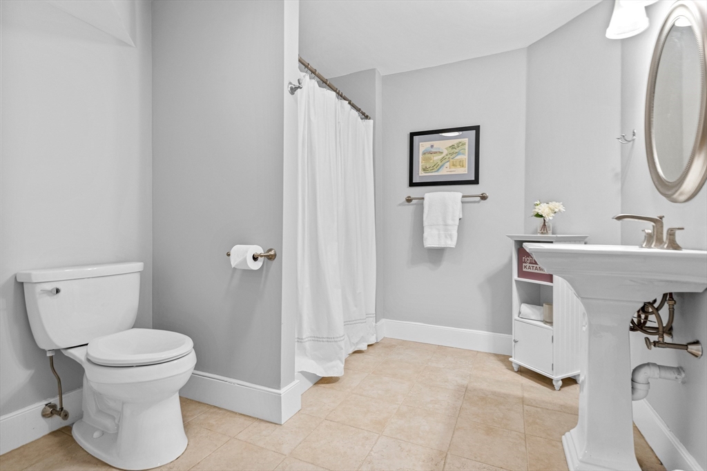 9 Patton Road Wellesley, MA 02482 - Photo 28 of 34 a bathroom with a toilet sink and mirror