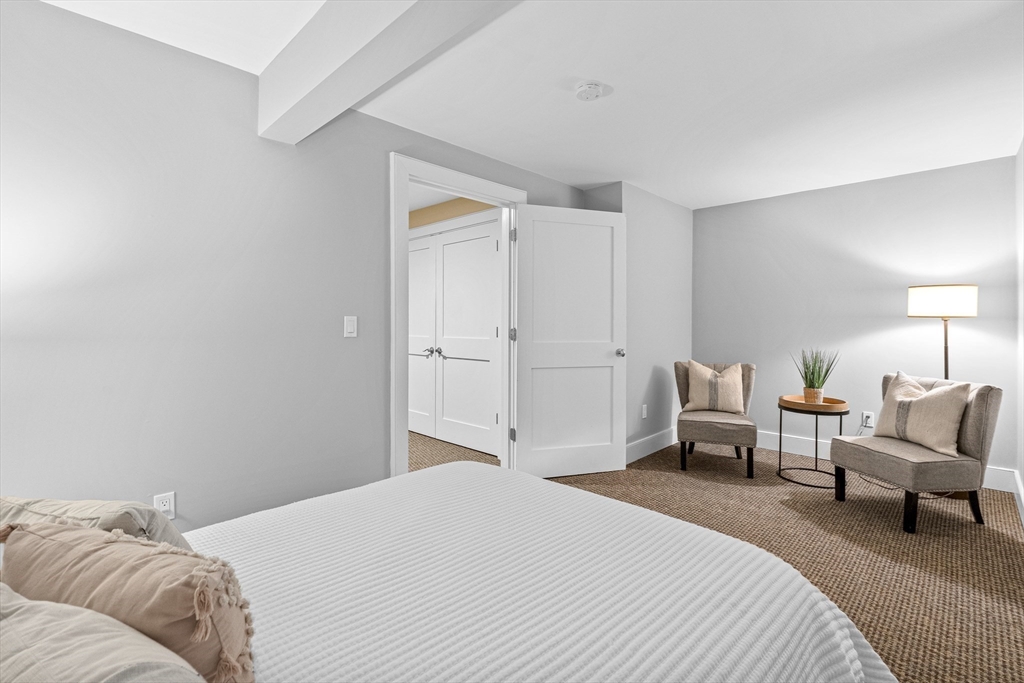 9 Patton Road Wellesley, MA 02482 - Photo 29 of 34 a bedroom with a bed and chair