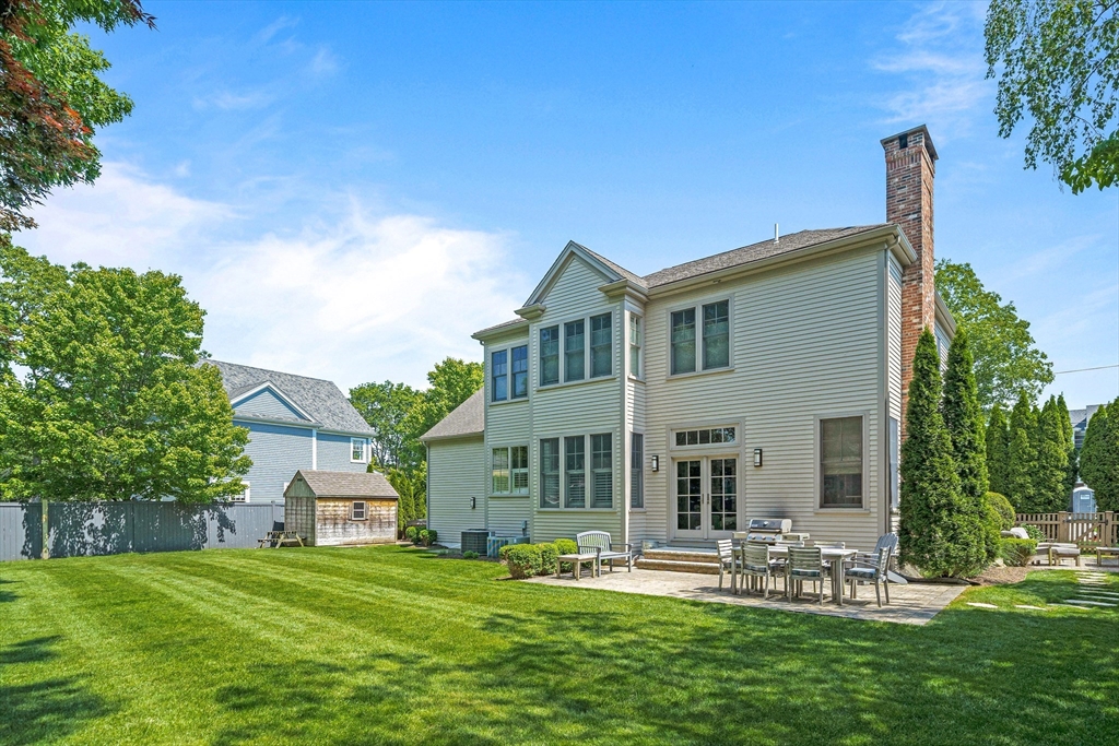 9 Patton Road Wellesley, MA 02482 - Photo 30 of 34 a front view of a house with a garden and plants