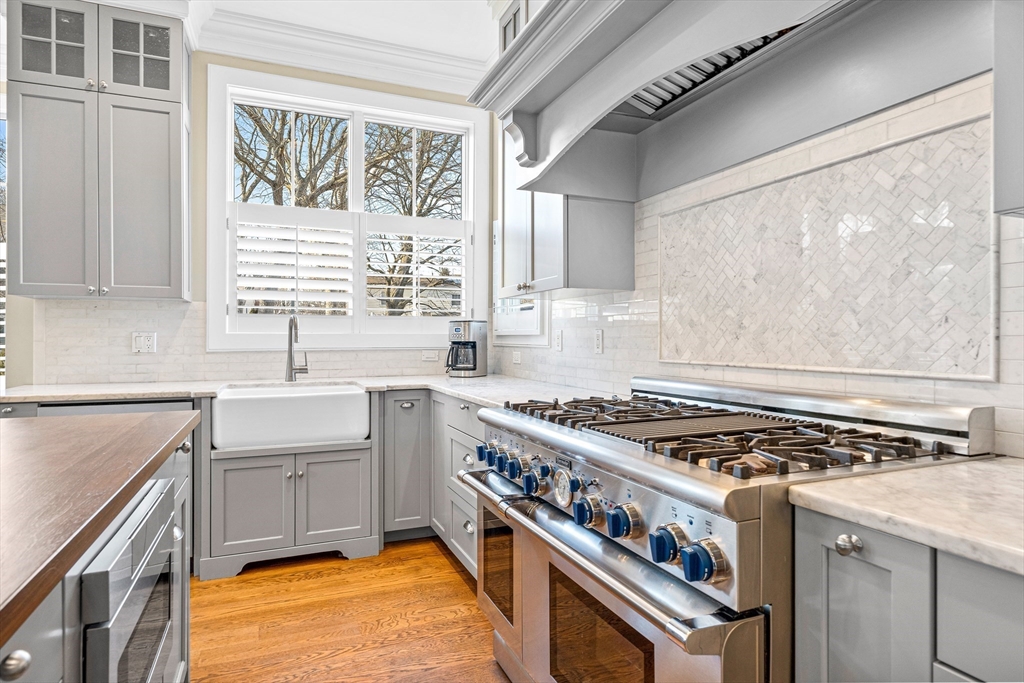 9 Patton Road Wellesley, MA 02482 - Photo 6 of 34 a kitchen with stainless steel appliances granite countertop a stove a sink dishwasher and a microwave