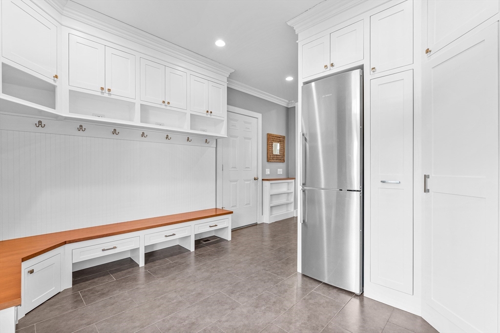 9 Patton Road Wellesley, MA 02482 - Photo 8 of 34 a room with white cabinets and stainless steel appliances