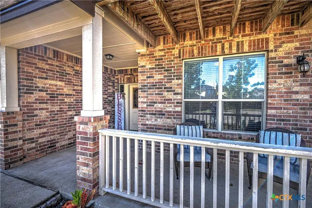 a view of a brick house with a large windows