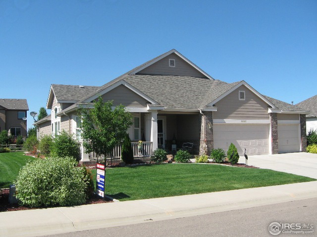 11805 North Beasly Road Longmont, CO 80504 - Photo 2 of 20 a front view of a house with a yard and trees