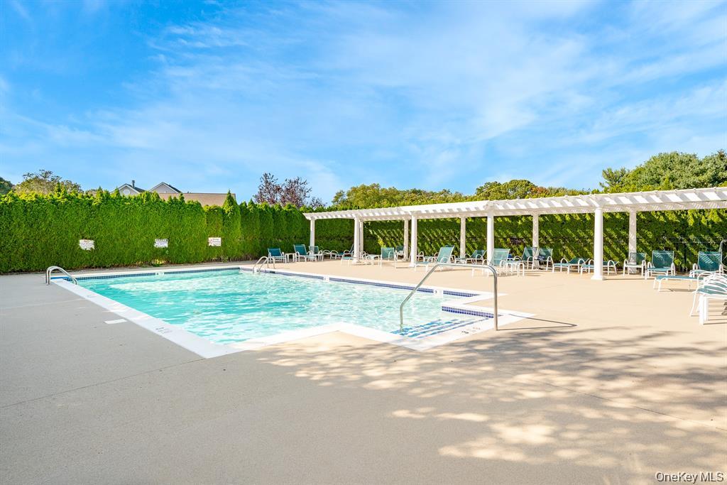 601 Pebble Beach Path Riverhead, NY 11901 - Photo 18 of 20 a view of house with a swimming pool