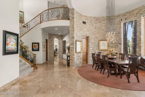 a kitchen with stainless steel appliances granite countertop a sink and a refrigerator