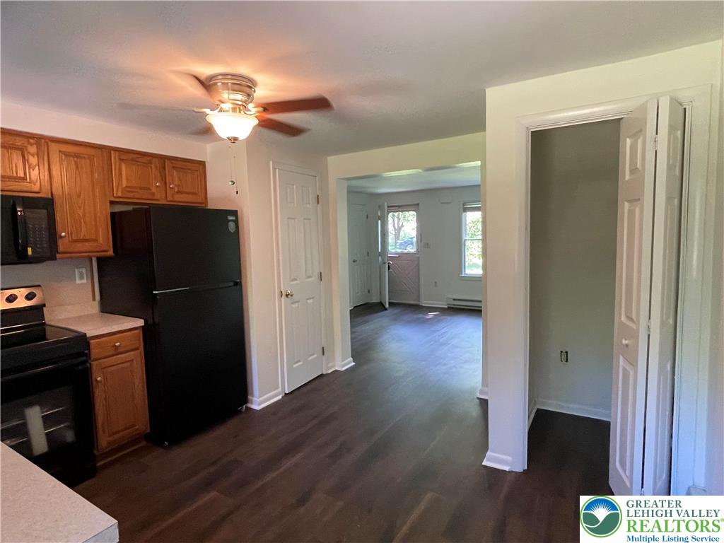 849 Weir Lake Road Kunkletown, PA 18058 - Photo 11 of 44 a view of a kitchen with refrigerator and wooden floor