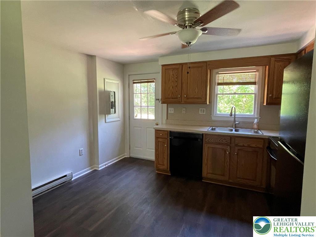 849 Weir Lake Road Kunkletown, PA 18058 - Photo 12 of 44 a kitchen with granite countertop a sink cabinets and wooden floor