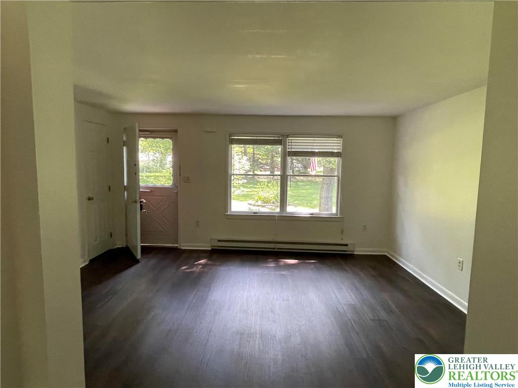 849 Weir Lake Road Kunkletown, PA 18058 - Photo 15 of 44 an empty room with wooden floor and windows