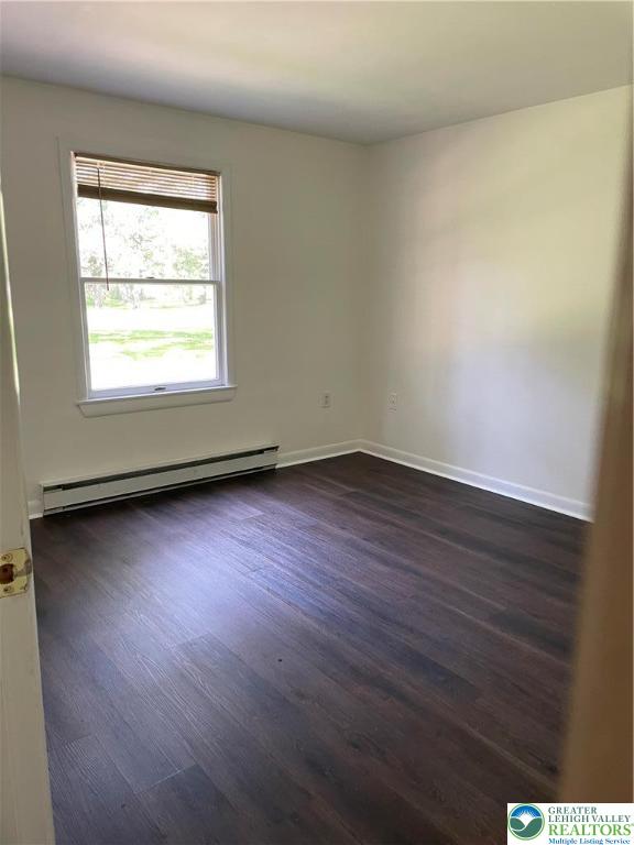 849 Weir Lake Road Kunkletown, PA 18058 - Photo 21 of 44 an empty room with wooden floor and windows