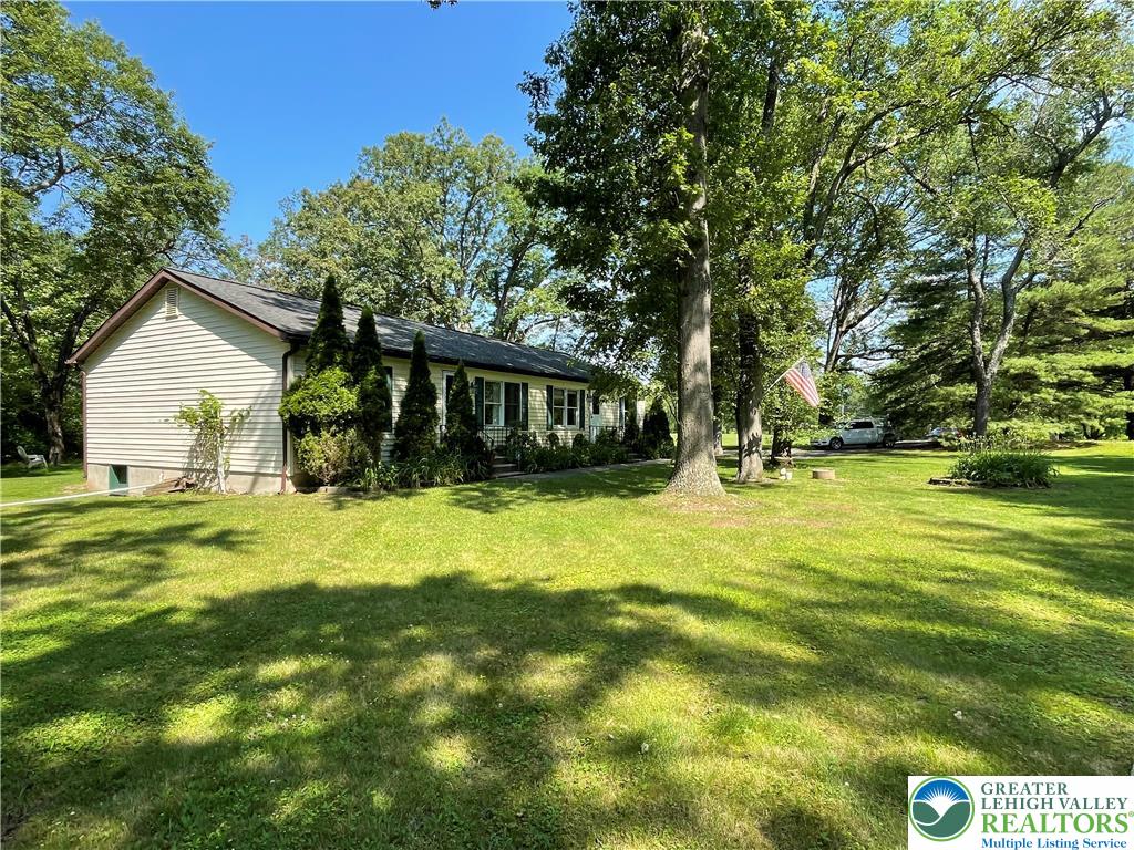 849 Weir Lake Road Kunkletown, PA 18058 - Photo 4 of 44 a front view of house with yard and trees