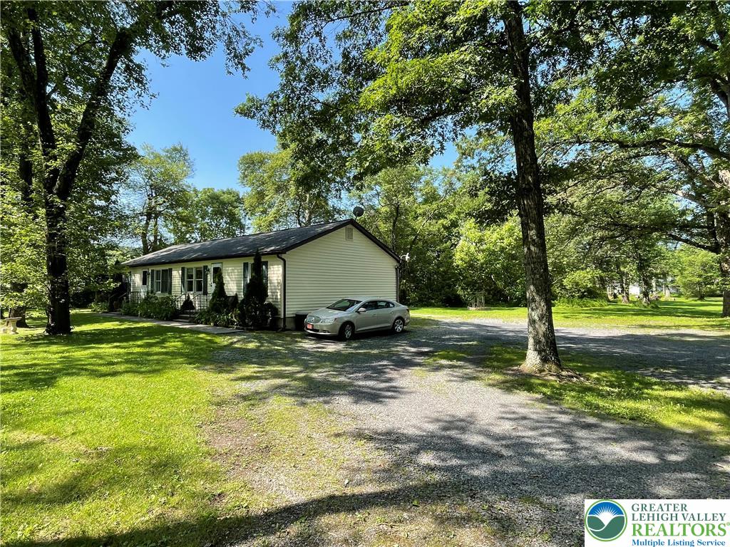849 Weir Lake Road Kunkletown, PA 18058 - Photo 5 of 44 a view of a house with a yard