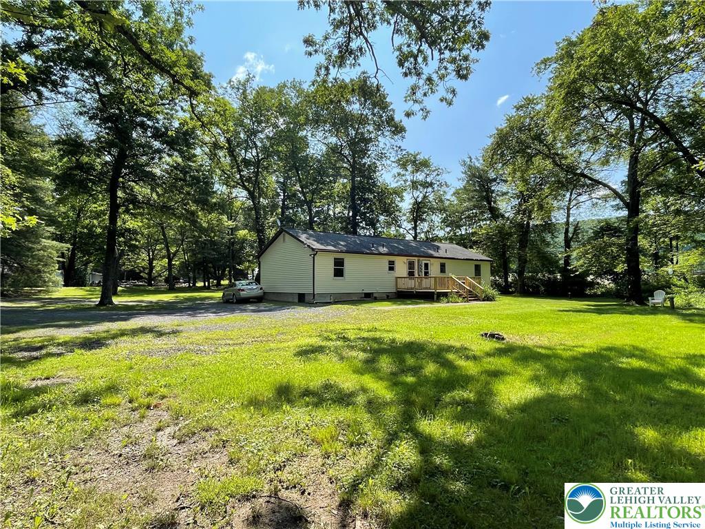 849 Weir Lake Road Kunkletown, PA 18058 - Photo 7 of 44 a view of a house with a yard