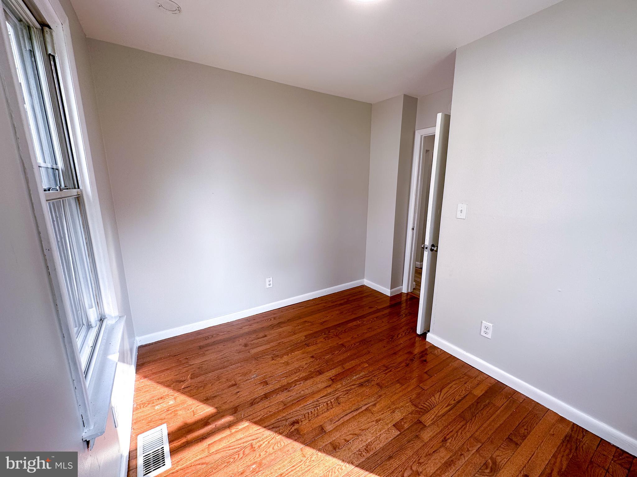 19 Lane Avenue, Unit 1 Gloucester City, NJ 08030 - Photo 13 of 18 an empty room with wooden floor