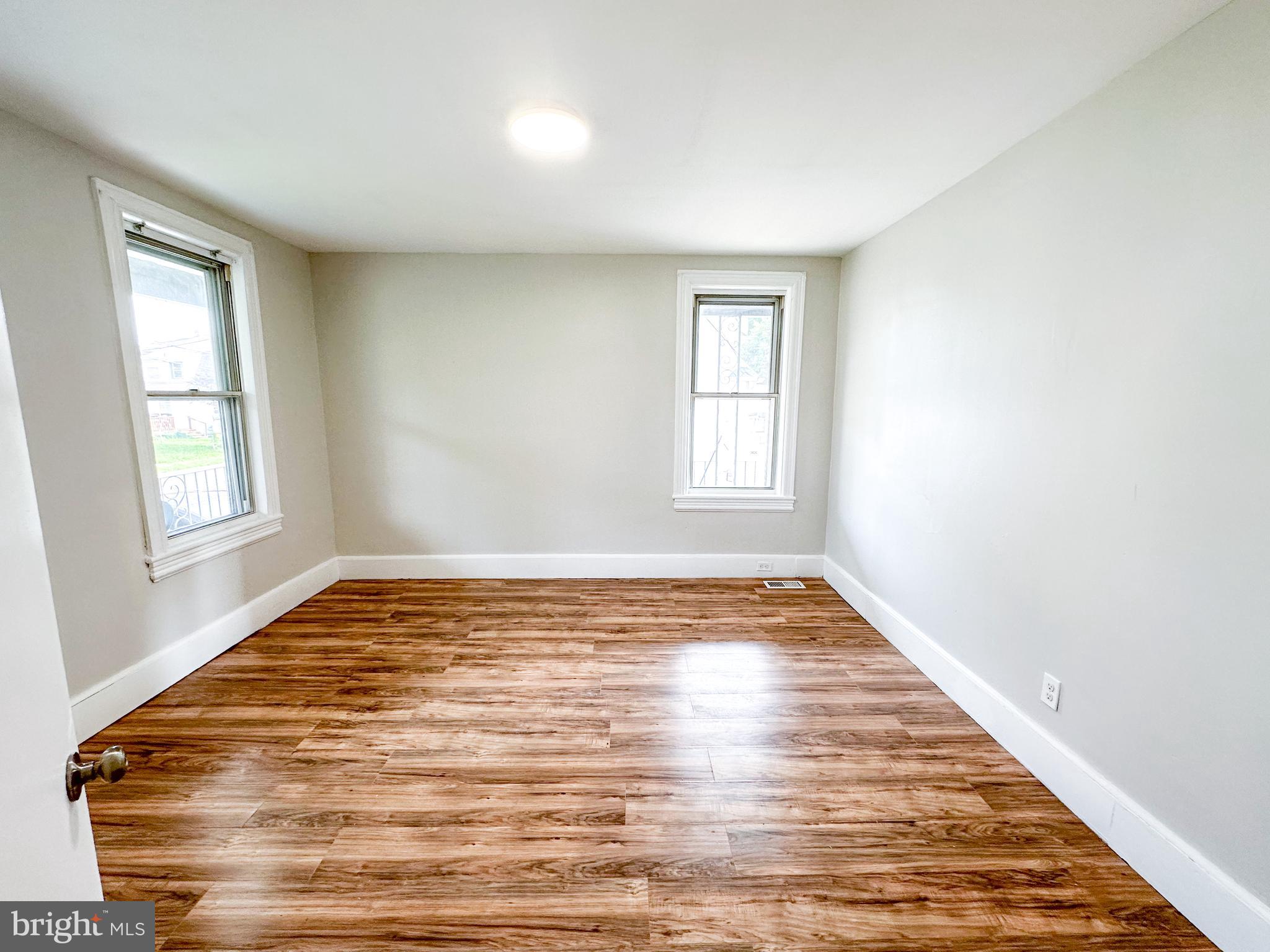 19 Lane Avenue, Unit 1 Gloucester City, NJ 08030 - Photo 15 of 18 a view of empty room with wooden floor and fan