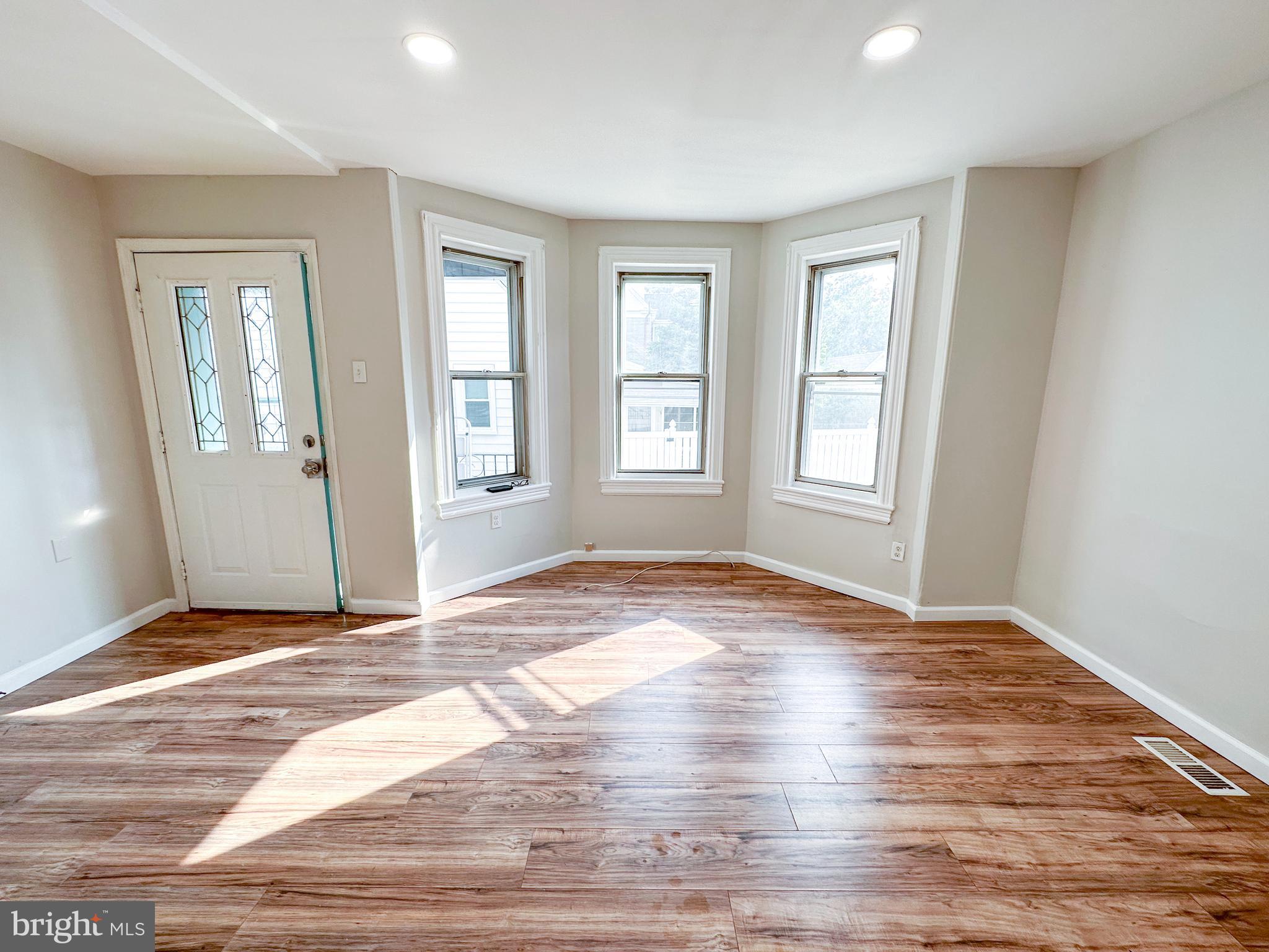 19 Lane Avenue, Unit 1 Gloucester City, NJ 08030 - Photo 5 of 18 a view of empty room with wooden floor and fan