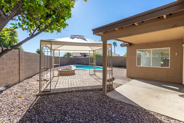 a view of a backyard of the house