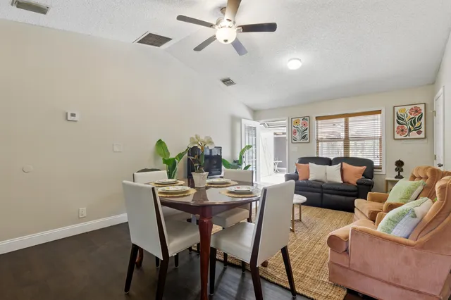 a view of a livingroom with furniture and a potted plant