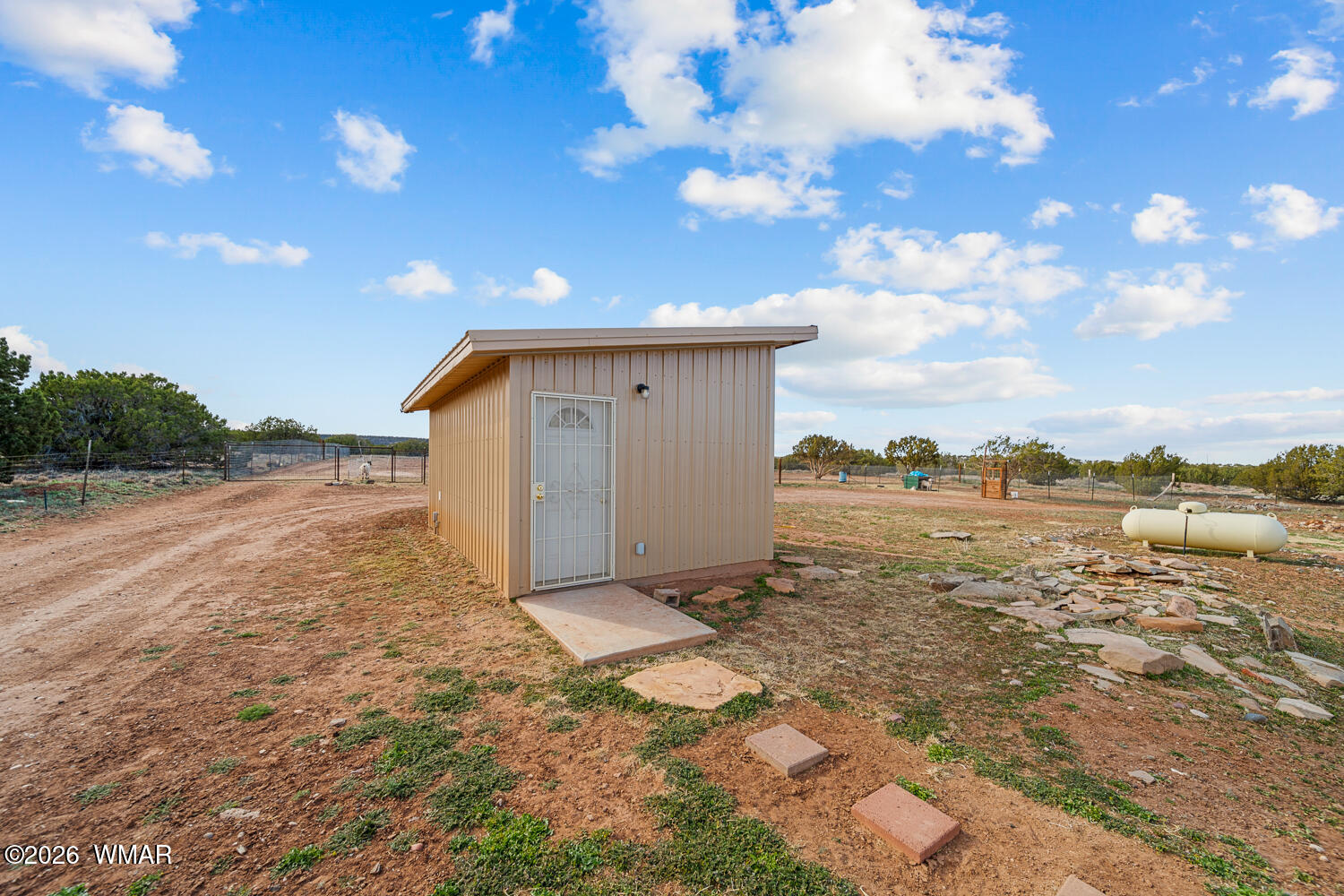 4066 East Pinto Road Snowflake, AZ 85937 - Photo 14 of 49 The metal-sided pump house/workshop (built November 2021) includes a sink, small water heater, ample electrical outlets, and an insulated space that can serve as a workshop or backup laundry room. Solar panels remain on the property (system not included).