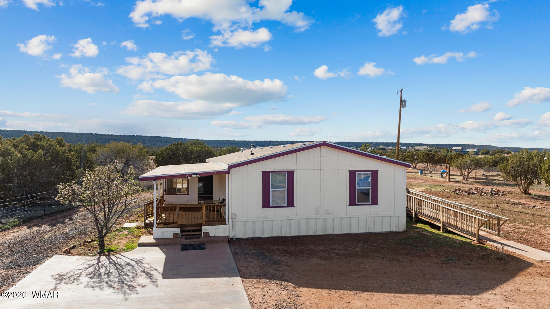 4066 East Pinto Road Snowflake, AZ 85937 - Photo 5 of 49 Designed with accessibility in mind, the home includes an ADA-compliant ramp on the back porch, double entry doors, widened hallways, and a walk-in ADA hall shower with handrails and widened doorway for wheelchair access.
