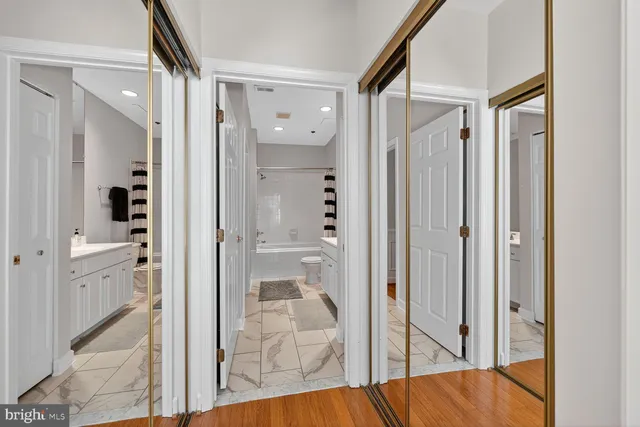 a view of a bathroom from a hallway