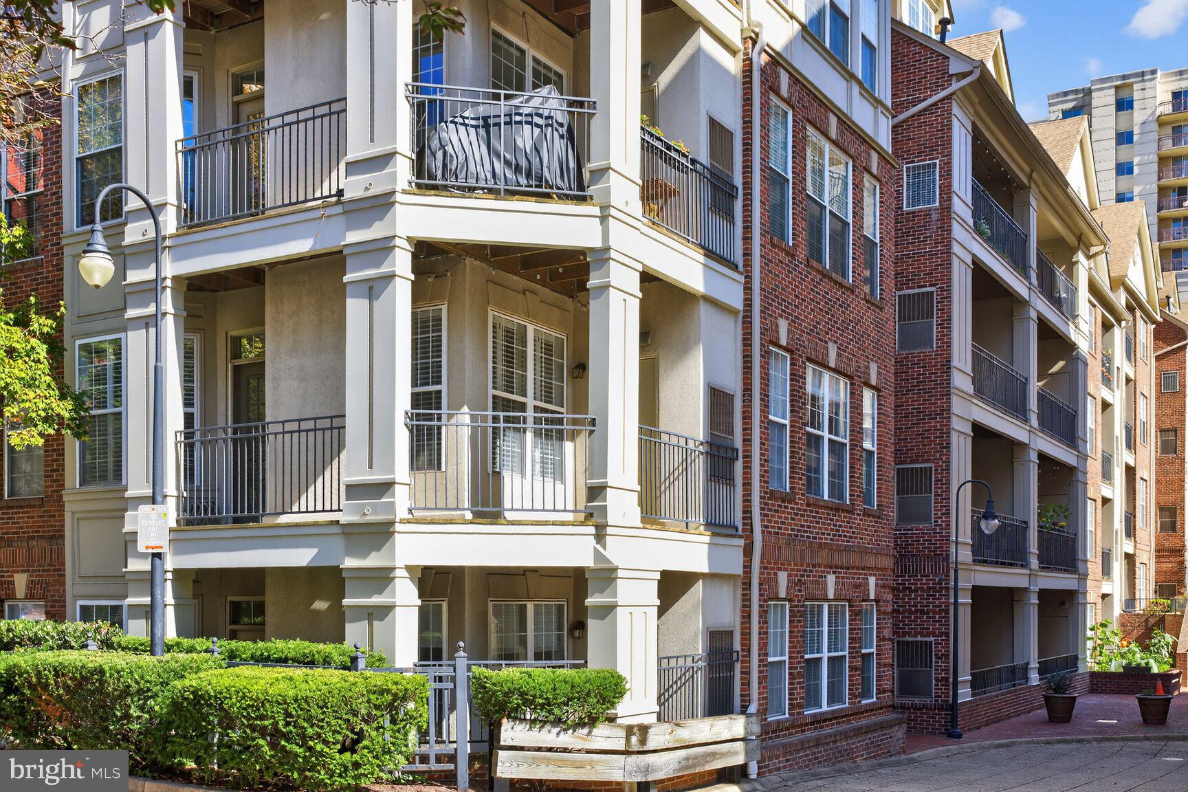 2330 14th Street North, Unit 205 Arlington, VA 22201 - Photo 2 of 29 a front view of a brick building with a lot of windows