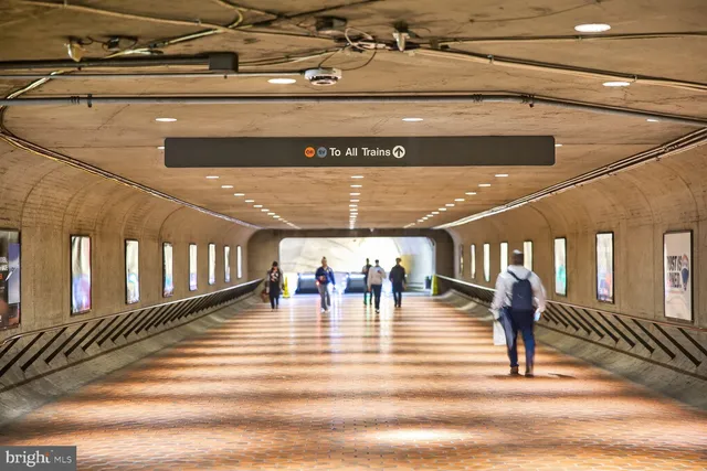a view of a brick building with a bench in front of building